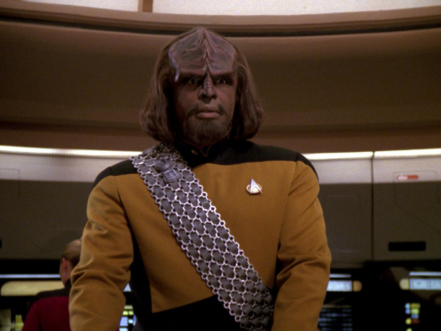 Worf, on duty, at his station on the Enterprise-D bridge in 'New Ground'