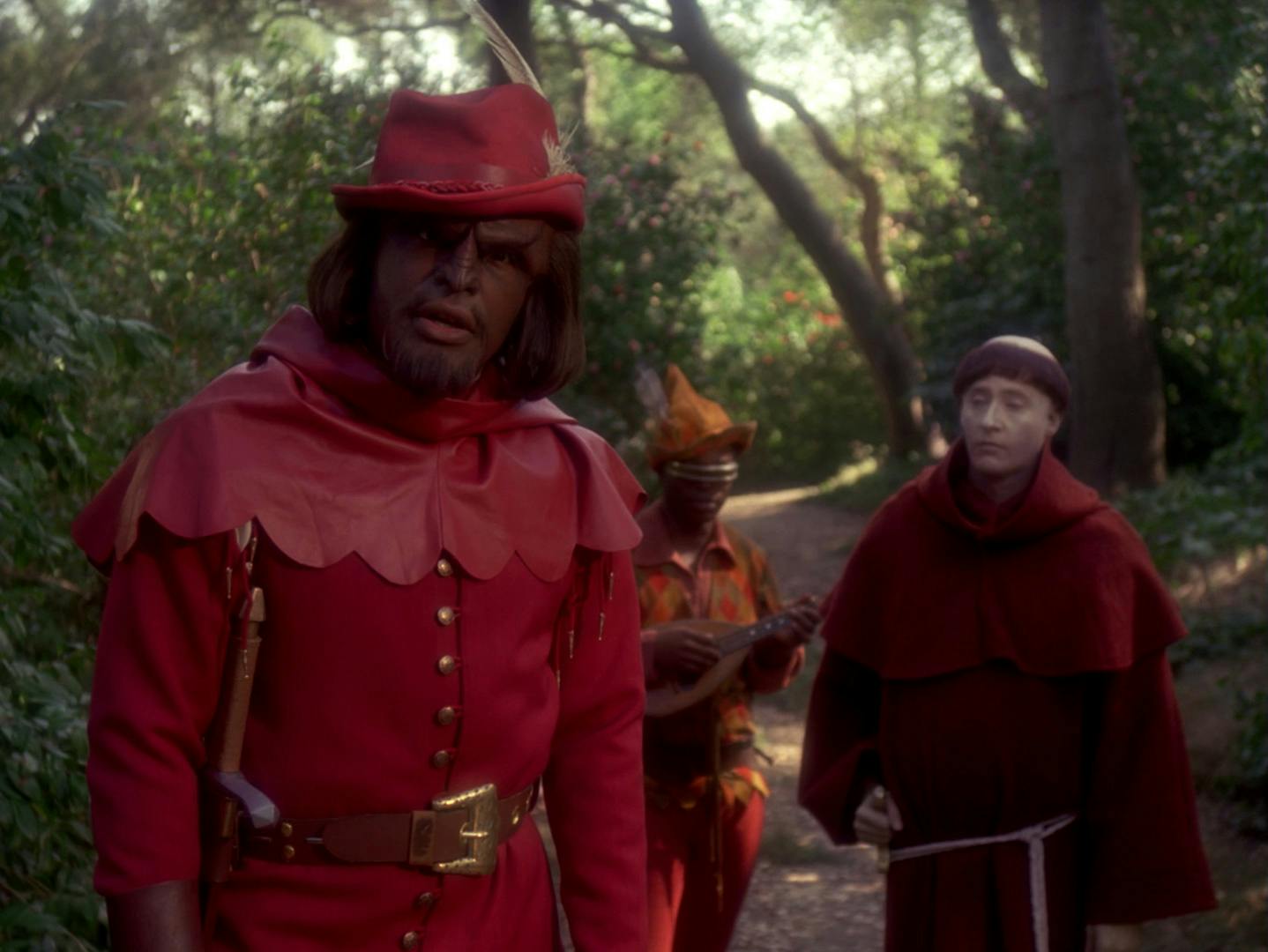 Worf, Geordi La Forge, and Data are placed in a Robin Hood and his Merry Men scenario in a wooded forest by Q in 'Qpid'