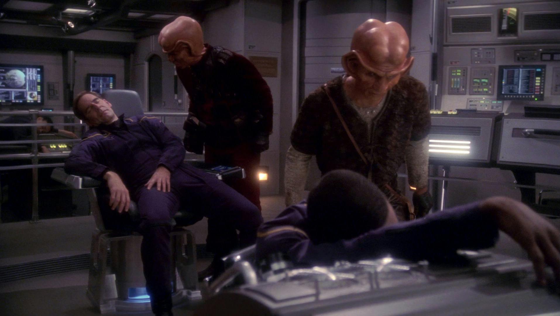 Ferengis aboard the NX-01 hover over an incapacitated Archer in 'Acquisition'