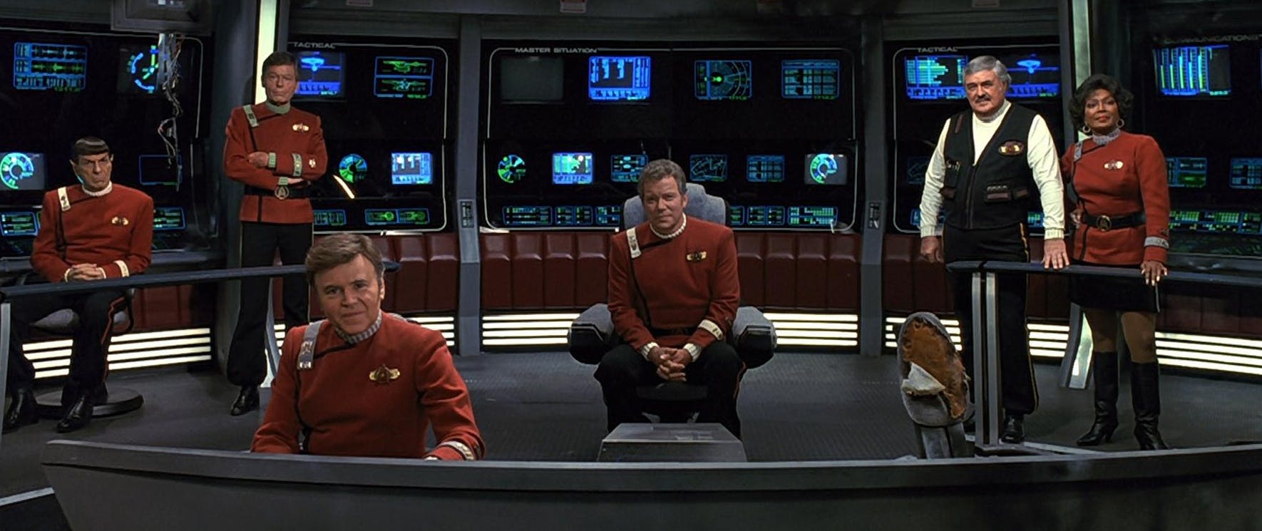 The original series crew (Spock, McCoy, Chekov, Kirk, Scotty, and Uhura) on the bridge of the Enterprise-A for a final mission together in Star Trek VI: The Undiscovered Country