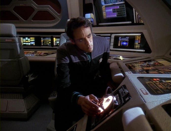 Seated in the shuttle, Dr. Bashir turns out to be a Changeling Imposter in 'By Inferno's Light'