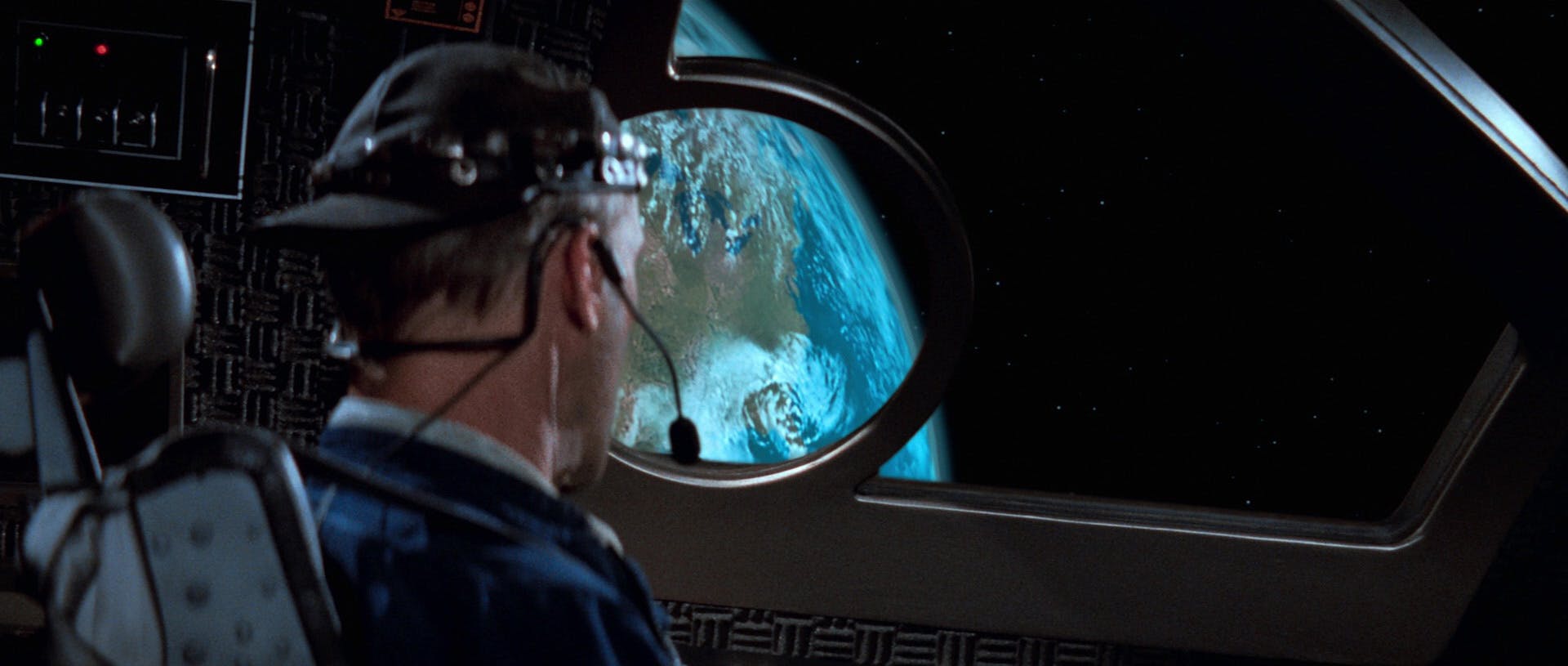 Zefram Cochrane looks out at the view of Earth from space in the Phoenix in Star Trek: First Contact