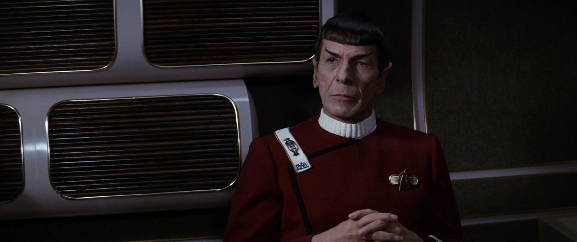 Close-up of a seated Spock with his hands folded in Star Trek II: The Wrath of Khan