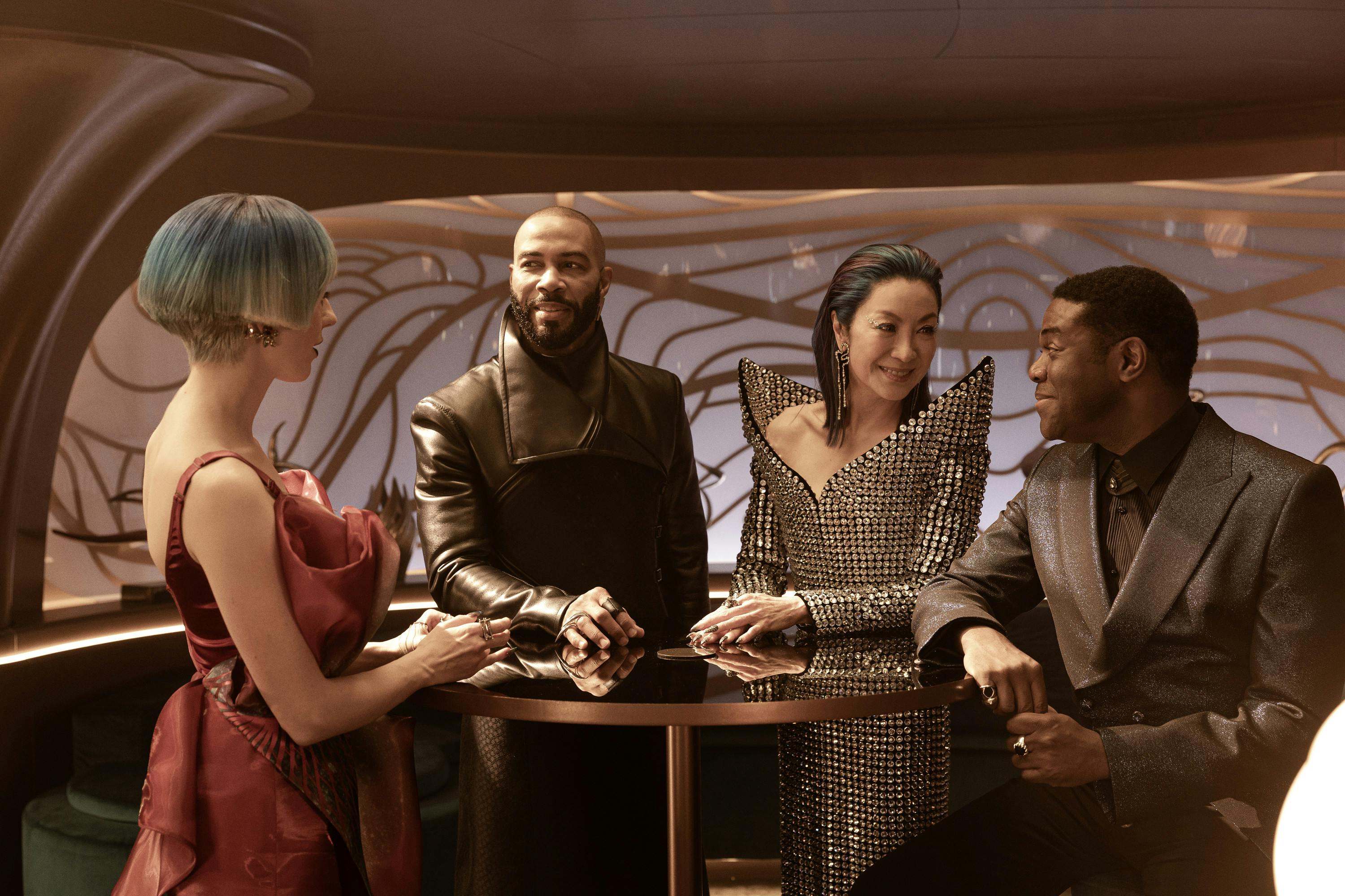 Rachel Garrett, Alok Sahar, and Quasi join Philippa Georgiou at a table at the Baraam in Star Trek: Section 31