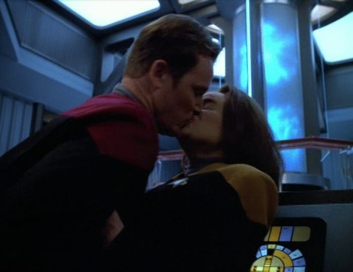 Alongside Voyager's warp core, Tom Paris and B'Elanna Torres engage in an intimate embrace in 'Scientific Method'