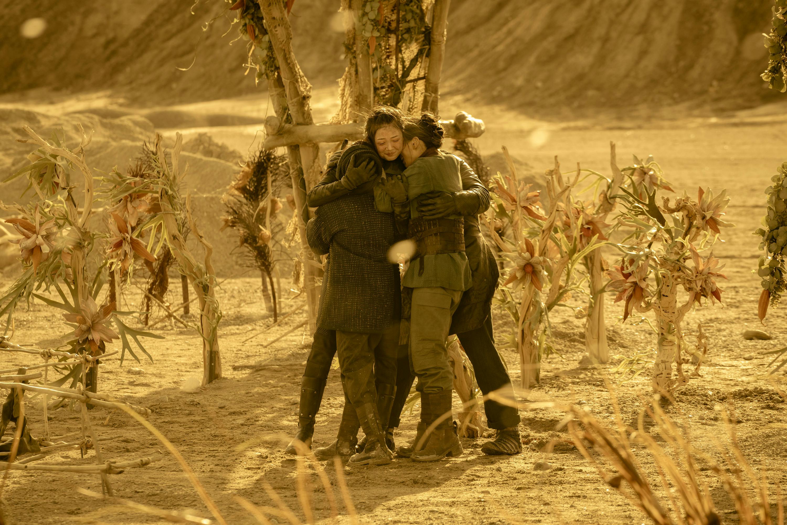 Young Philippa Georgiou reunites with her parents and younger brother, embracing them, on their farm in Star Trek: Section 31