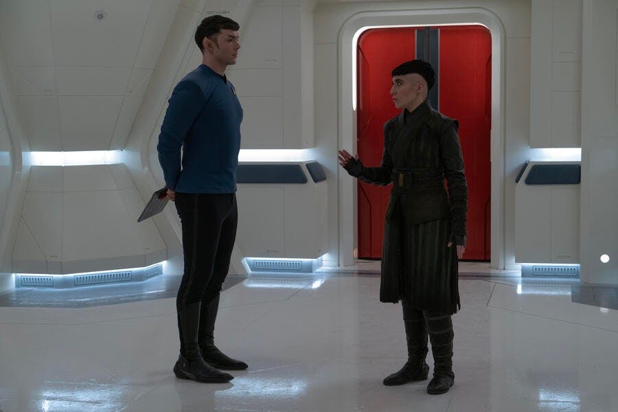 Erica Ortegas, in Kalar civilian attire, expresses frustration as she faces Spock raising her hand to tell him to stop in 'Among the Lotus Eaters'