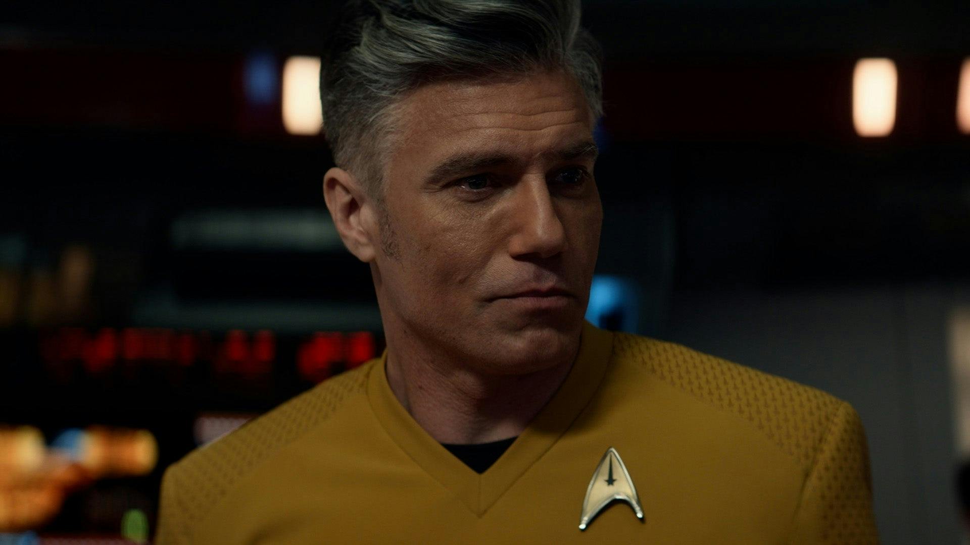 Close-up of Captain Pike as he looks over to his left