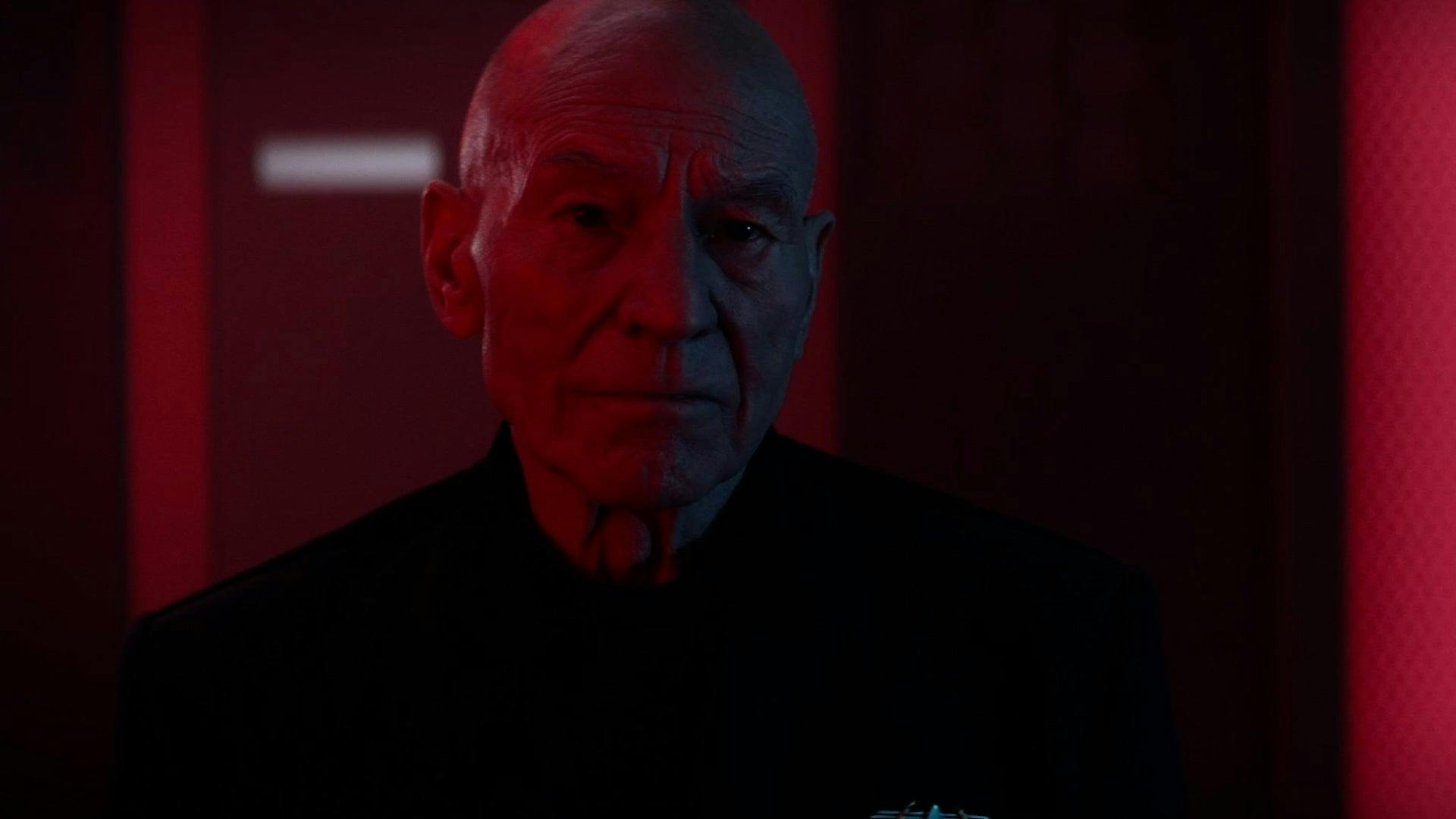Picard, alone in crewman's quarters on the Titan, looks glumly in front of him
