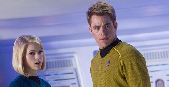 Alice Eve as Dr. Carol Marcus and Chris Pine as Kirk
