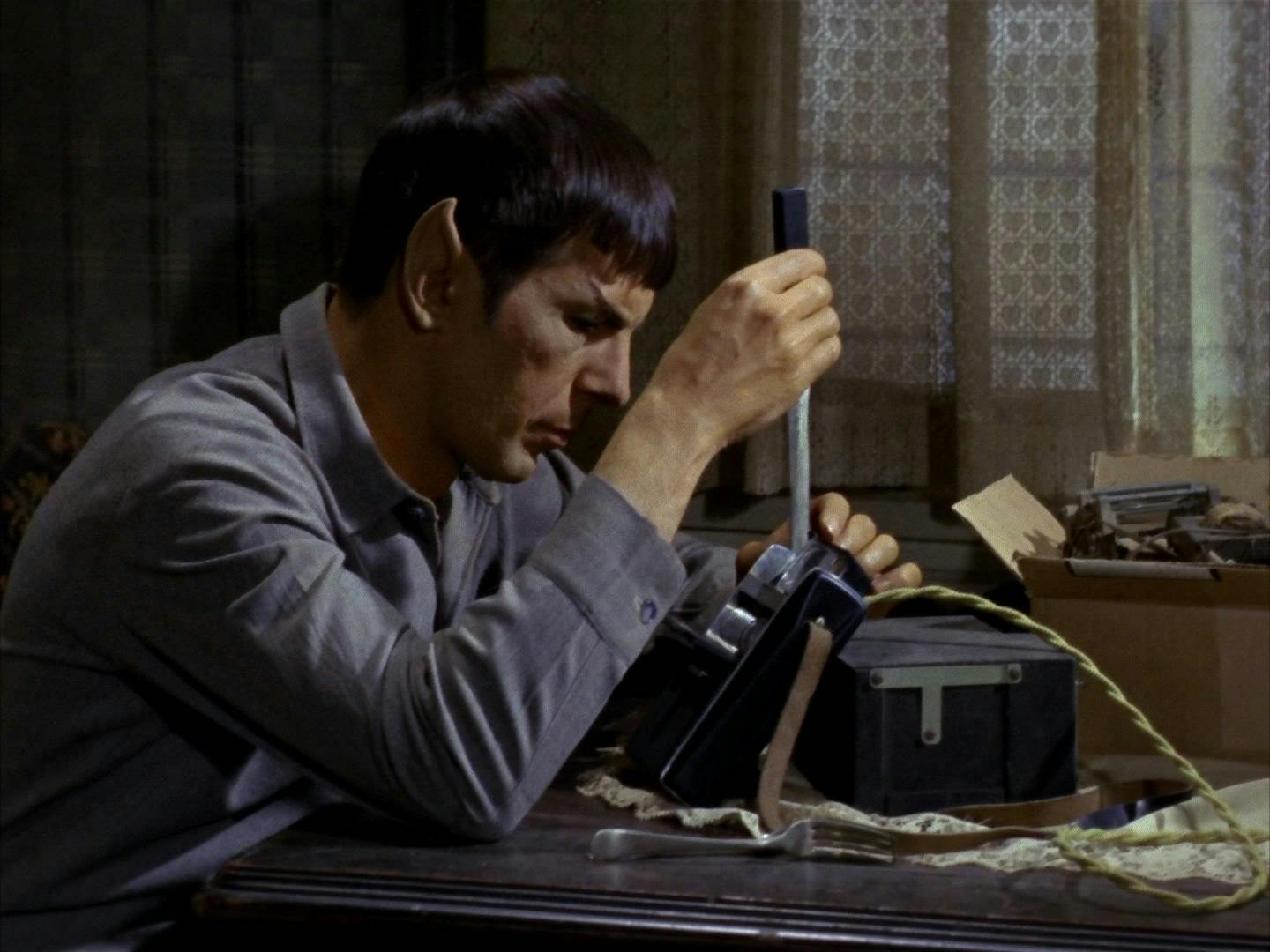 Spock attempts to rebuild a tricorder