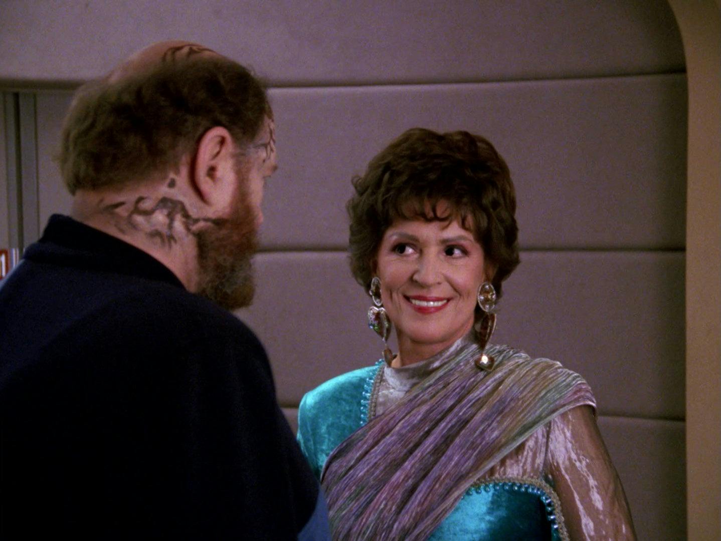 Lwaxana Troi stares lovingly at Timcin in Star Trek: The Next Generation - Half A Life