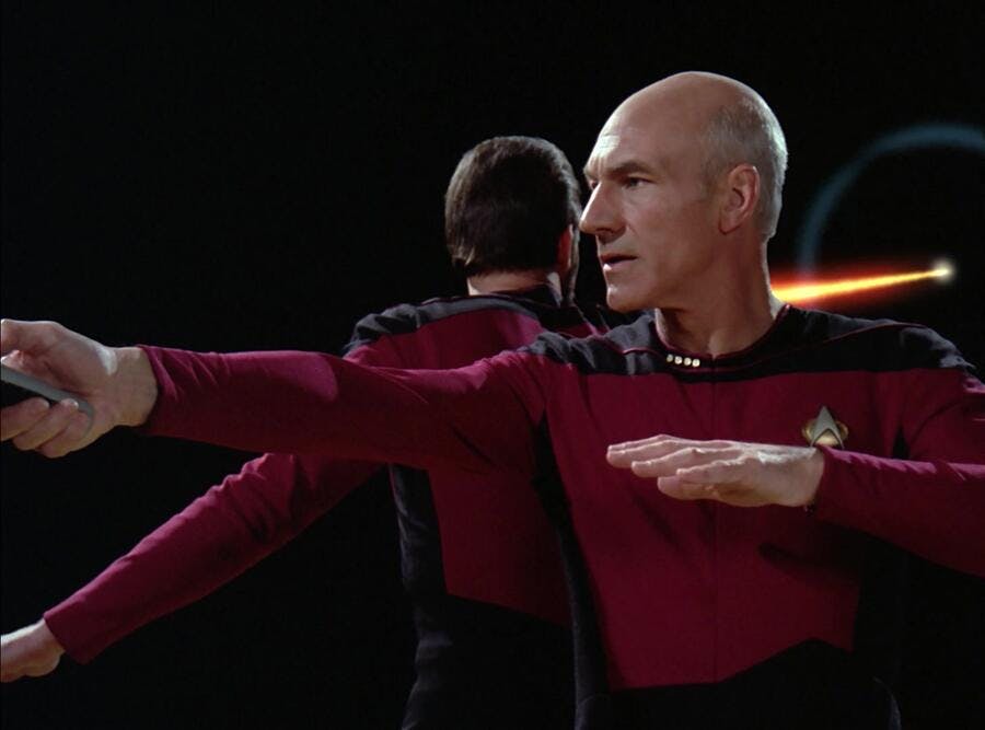 Picard and Riker stand back-to-back during phaser practice as the captain looks over his right shoulder in 'A Matter of Honor'