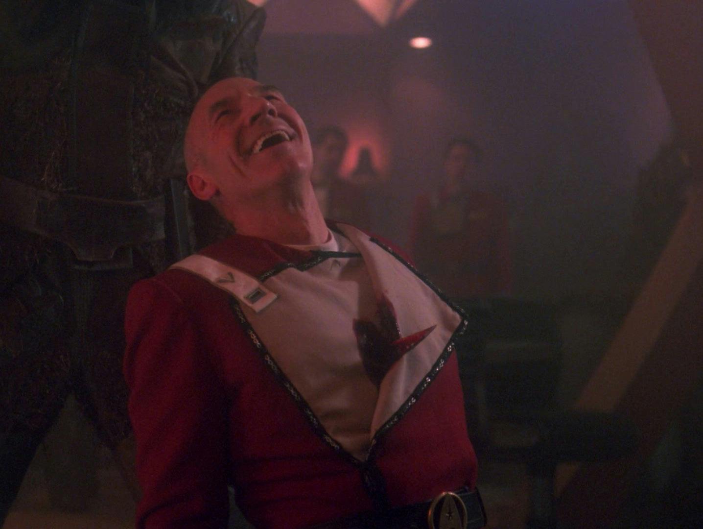 A young cadet Picard is impaled through his heart by a Nausicaan, leans back and heartily laughs in 'Tapestry'