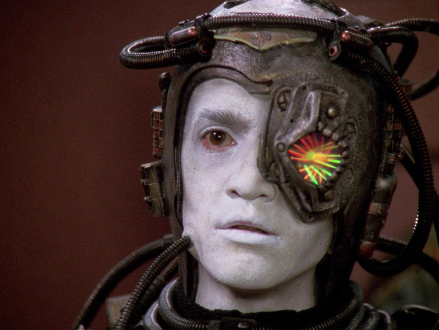 A close up of Hugh, with Borg implants covering most of the left side of his face.