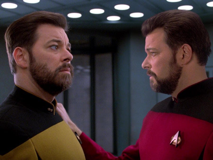 Thomas Riker and Will Riker face to face as Will grabs Thomas' arm in 'Second Chances'