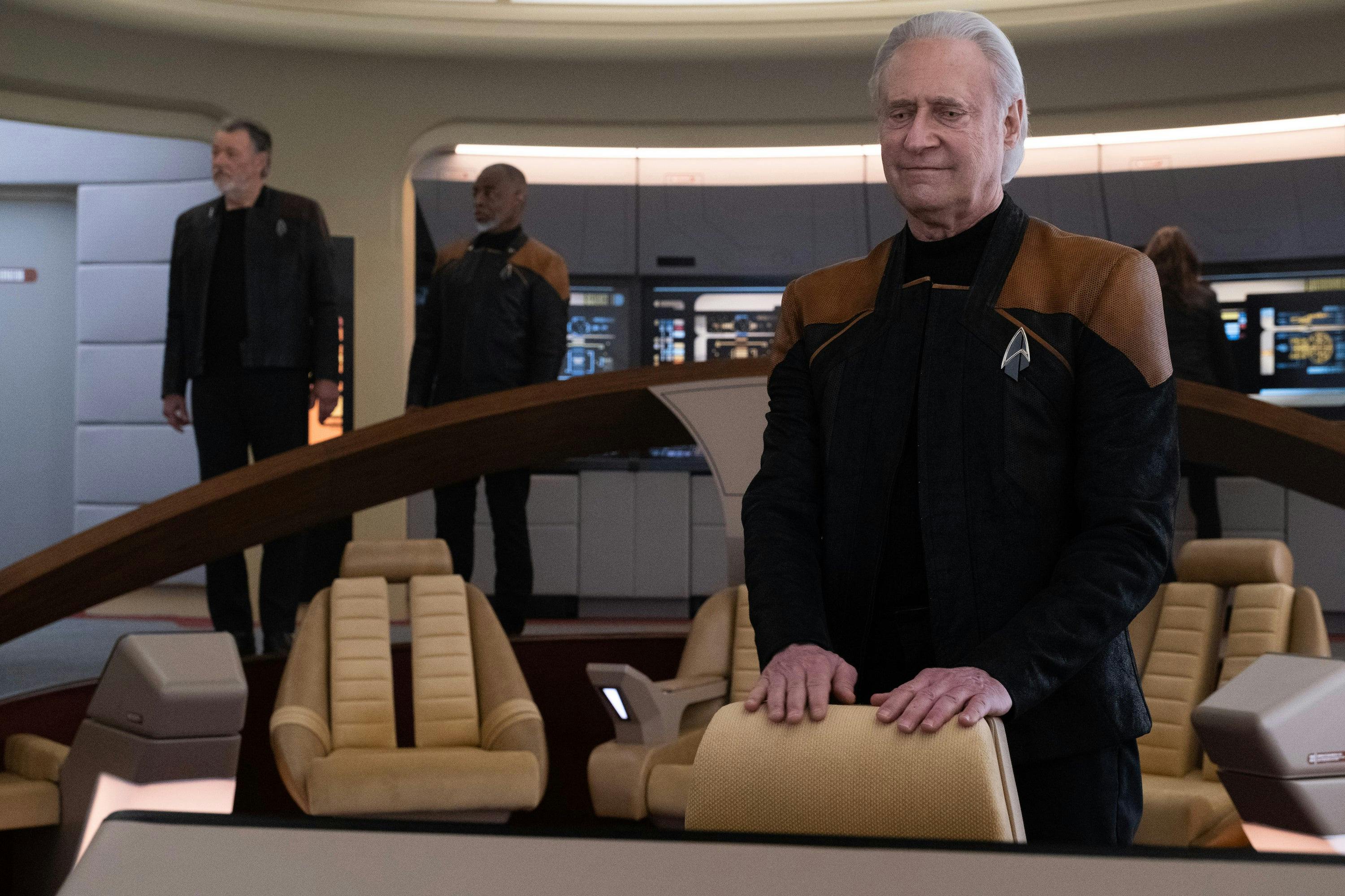 Data smiles at his old nav station aboard the reconstructed Enterprise-D as Riker and Geordi take in being back on their old ship in 'Vox'