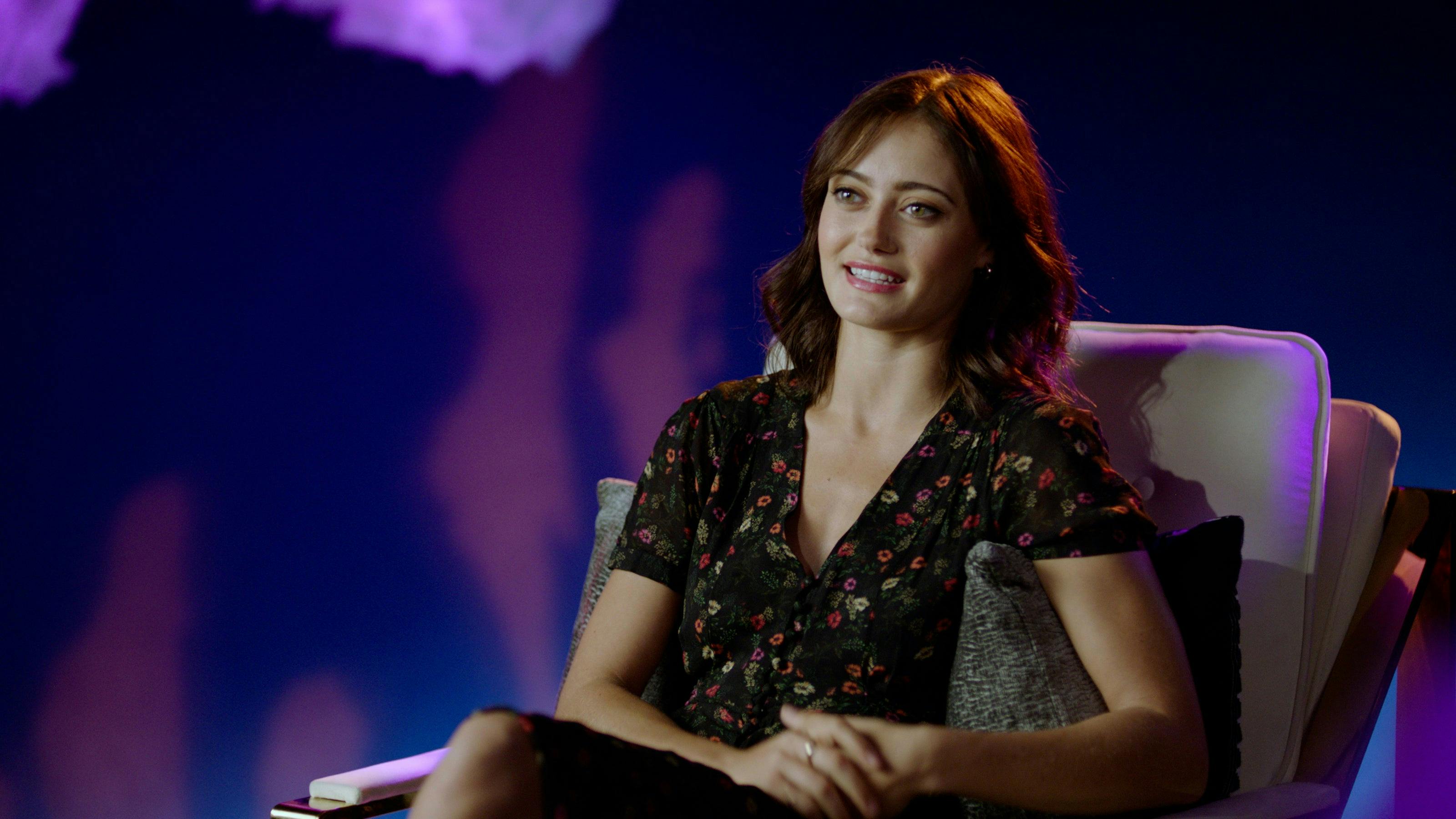 Ella Purnell who plays Gwyndala on Star Trek: Prodigy leans back on a chair