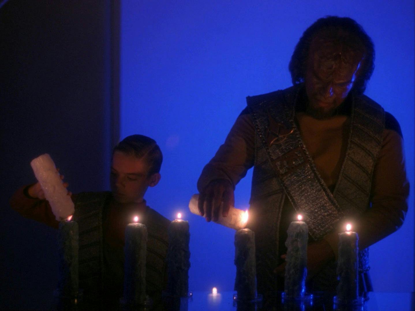 Worf connects with Jeremy Aster telling the young child his own parents were also killed in the line of duty, and offers to perform a Klingon ritual, the R'uustai, with Jeremy to make him a member of Worf's house and make them brothers in 'The Bonding'