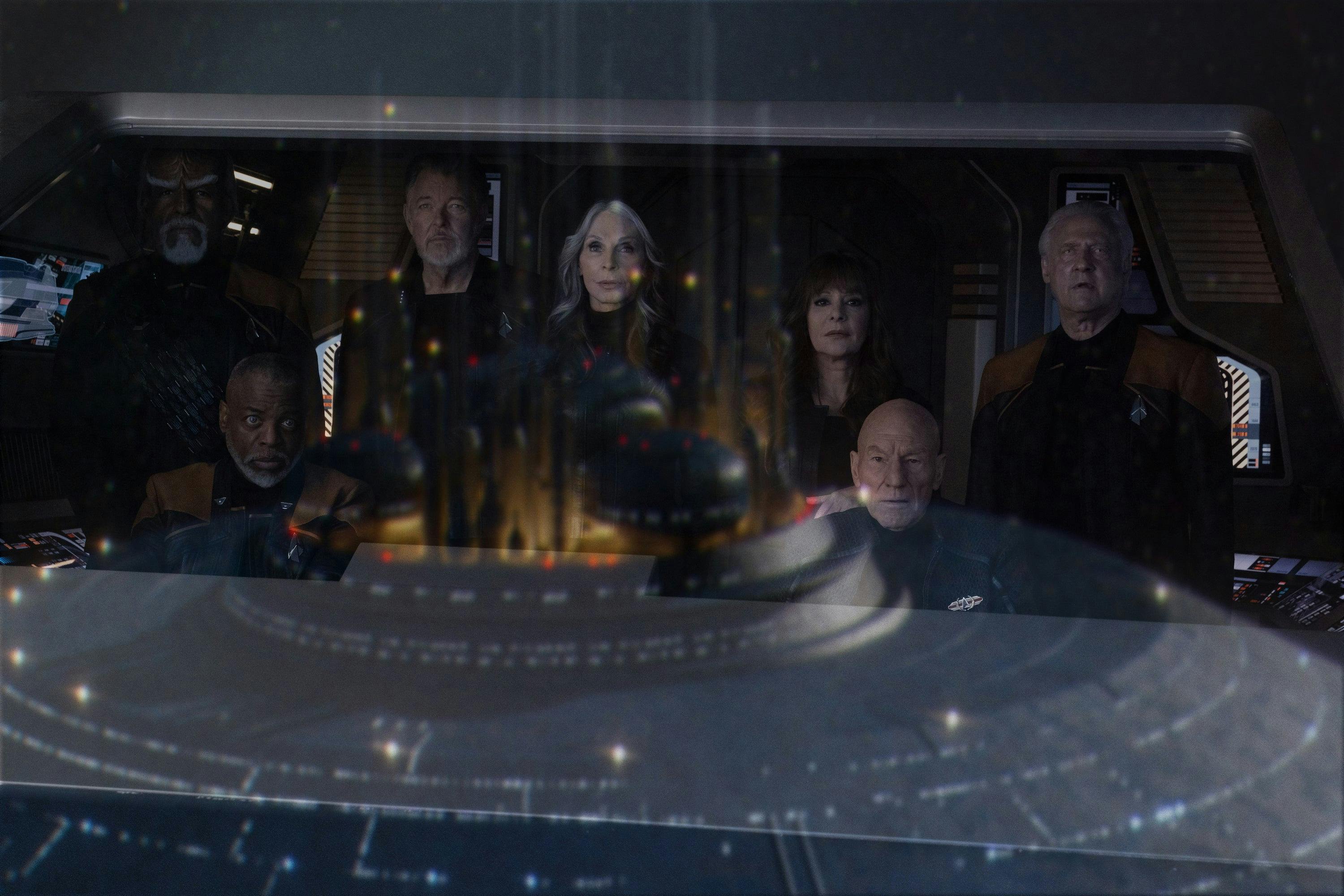 Aboard the shuttle, the old crew (Geordi, Riker, Beverly, Deanna, Picard, Data, and Worf admire the reconstructed Enterprise-D in front of them in 'Vox'