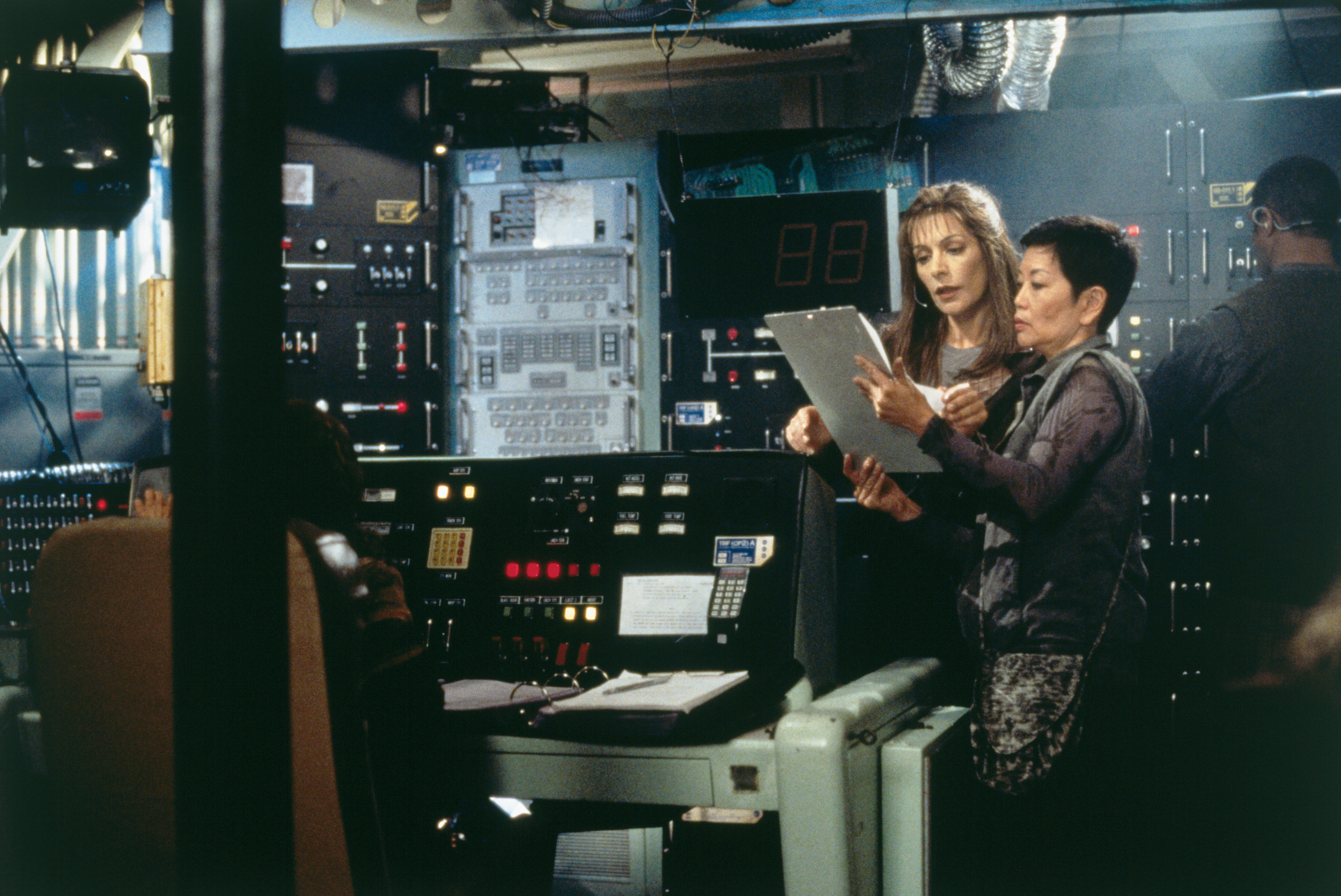 Marina Sirtis reviewing script with crew member on set of First Contact