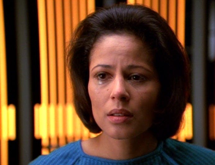 B'Elanna Torres, without her Klingon features, looks upset.