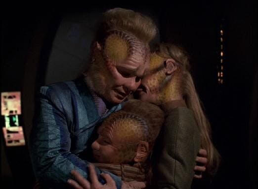Neelix embraces a Talaxian and her son in 'Homestead'