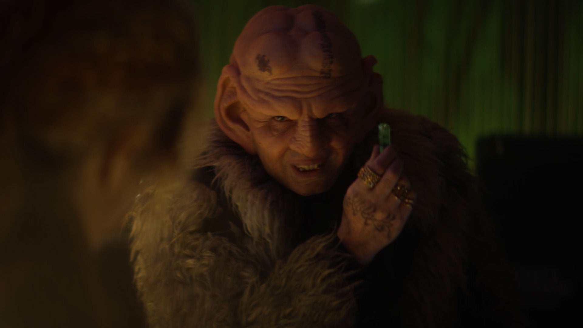 Close-up look at Sneed in a shady District Six in Star Trek: Picard