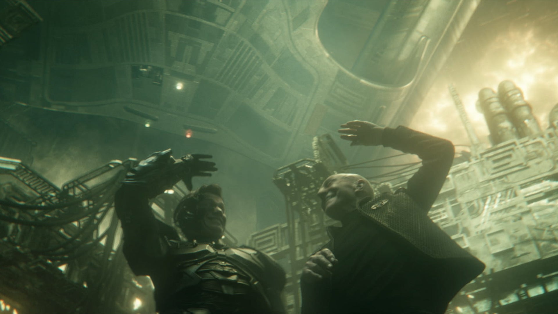 Ed Speleers and Sir Patrick Stewart smiling with their arms raised on the set of Star Trek: Picard