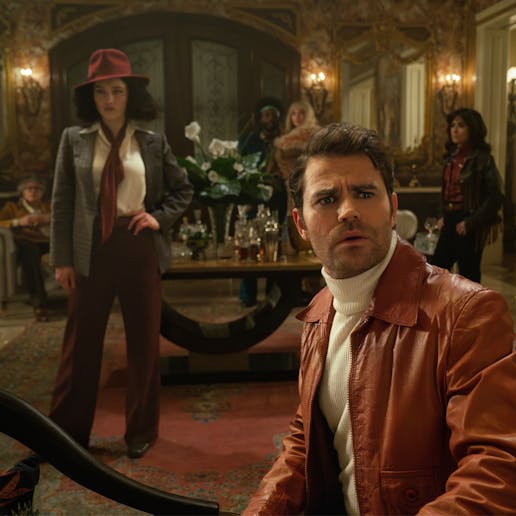 A seated James T. Kirk looks up in surprise as La'An, Ortegas, Christine Chapel, and M'Benga stands behind him in an ornate house