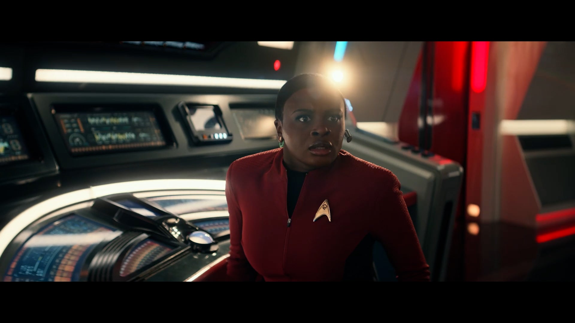 At her station, Uhura looks over in horror towards the viewscreen in 'Lost in Translation'