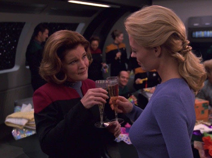 Janeway and Seven of Nine raise their glasses in cheers in 'Human Error'