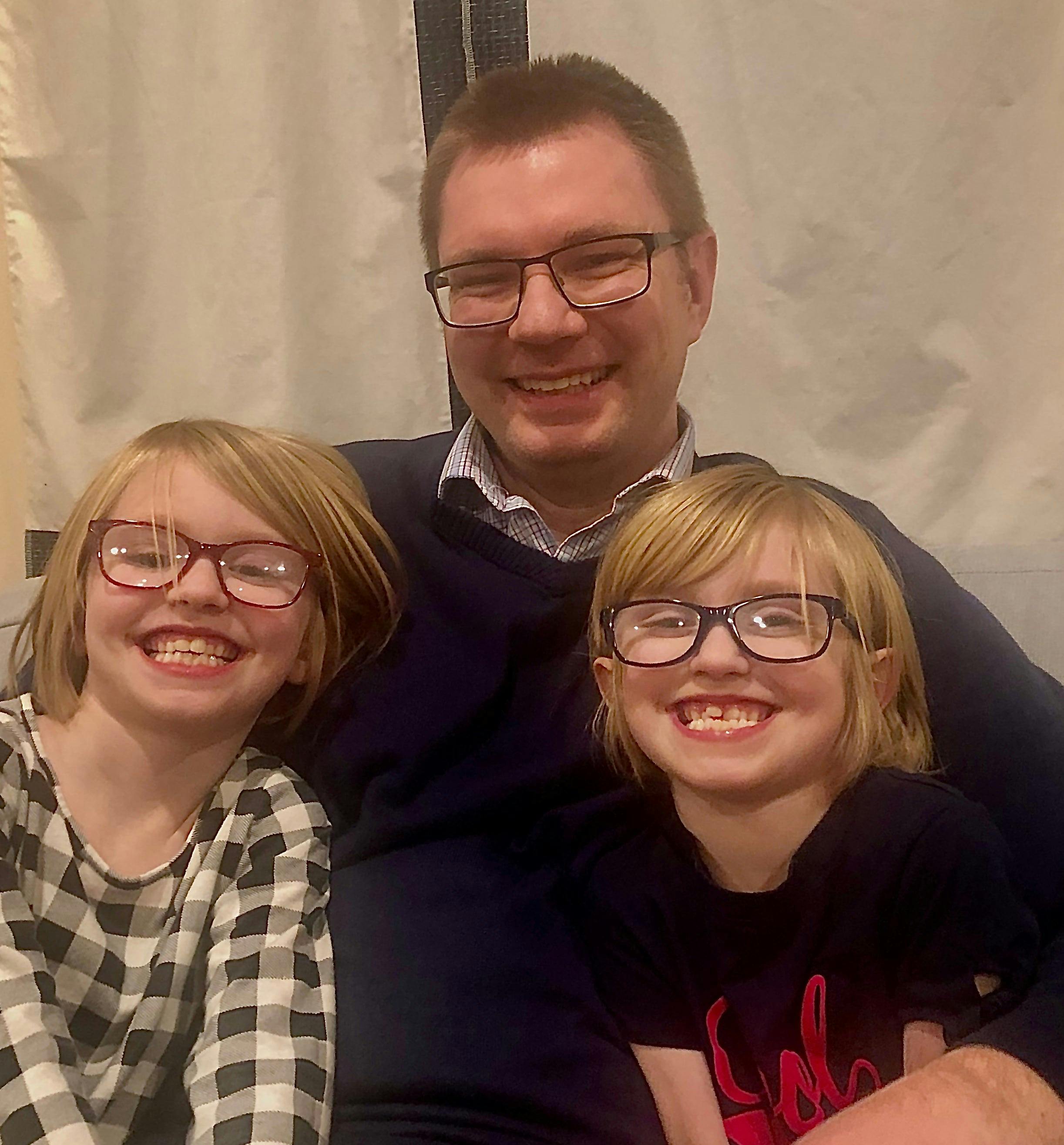 Author Jake Black, and his daughter's Elisabeth Hope and Faith.