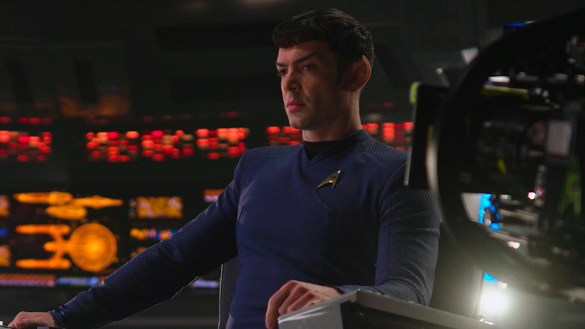 Behind-the-scenes still of Ethan Peck on the bridge set of the U.S.S. Enterprise