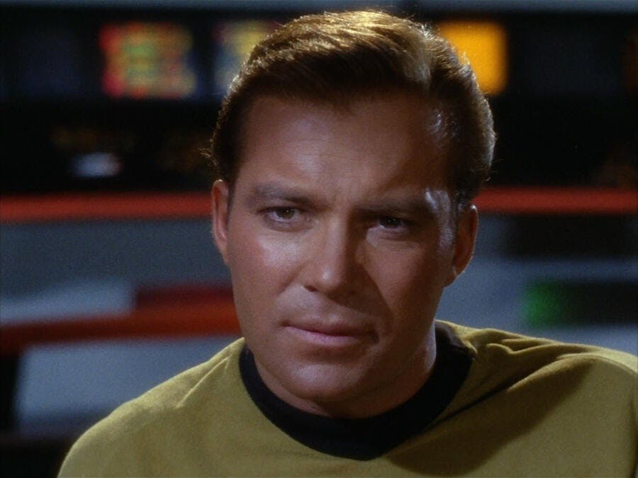 A close up of Captain Kirk (The Original Series) on the bridge of the Enterprise.
