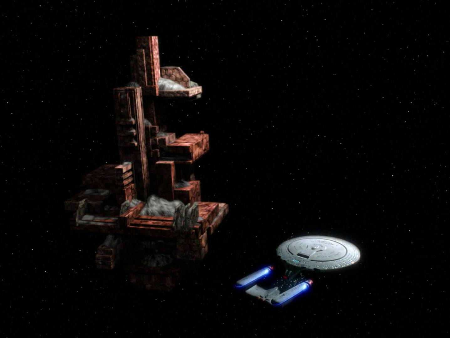 The Enterprise-D stands beside an the D'Arsay System artifact in 'Masks'