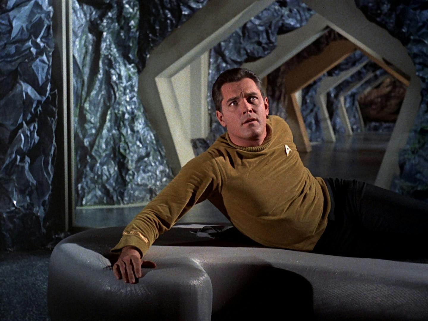 Captain Pike wakes up disoriented and confused as a captive of the Talosians in 'The Cage'
