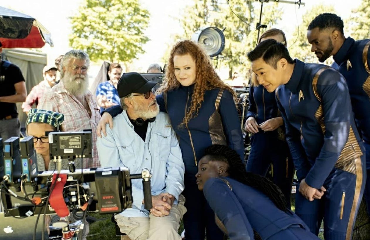 Behind-the-scenes photo of Discovery's bridge crew with director Jonathan Frakes