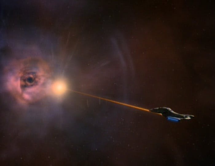 A Voyager shuttle with B'Elanna Torres and Janeway charge a dekyon beam at the site of a quantum singularity in hopes of expanding the hole in 'Parallax'