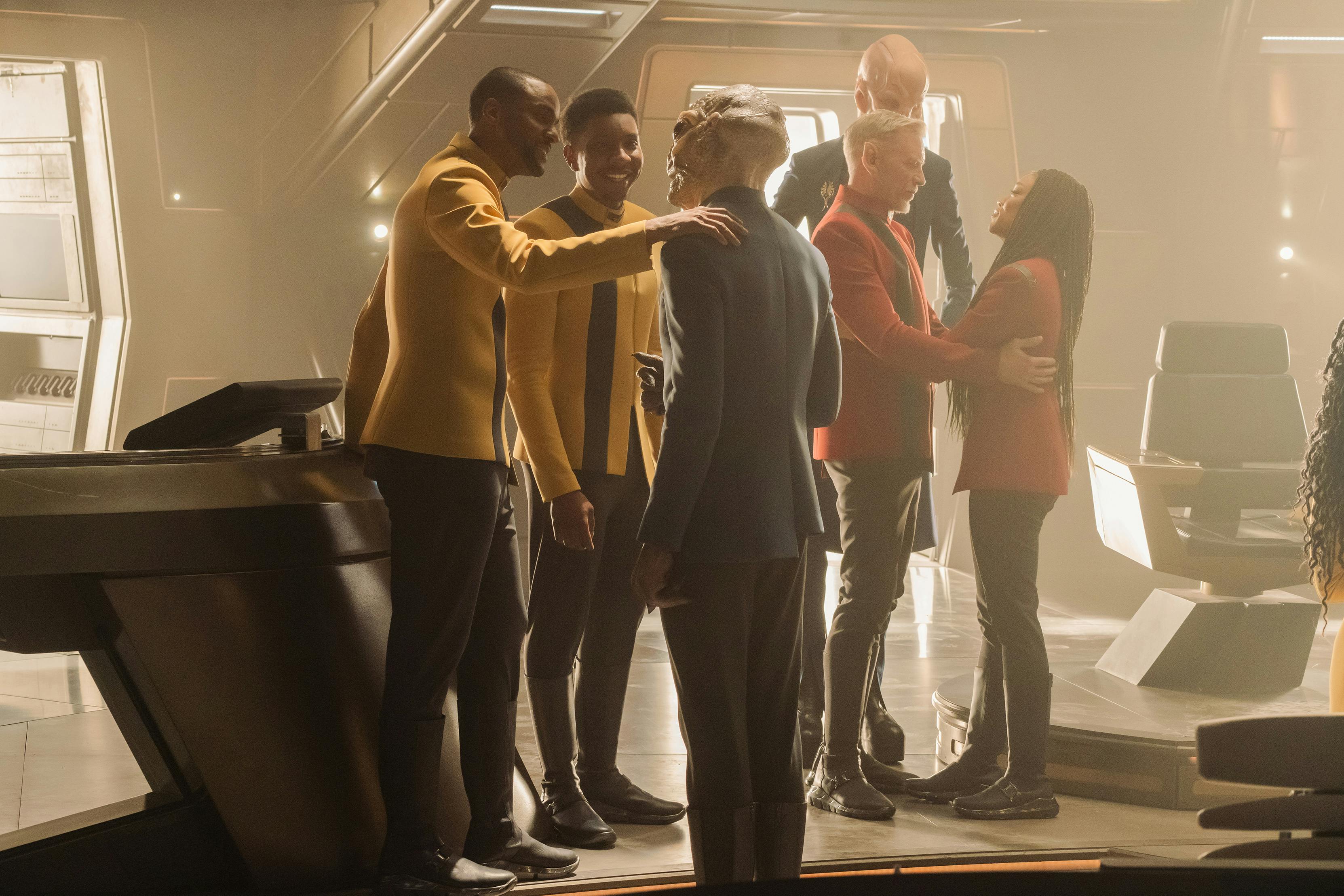 In a flashback, Christopher and Bryce converse with Linus as Rayner and Burnham embrace and Saru looks on the bridge of Discovery in 'Life, Itself'