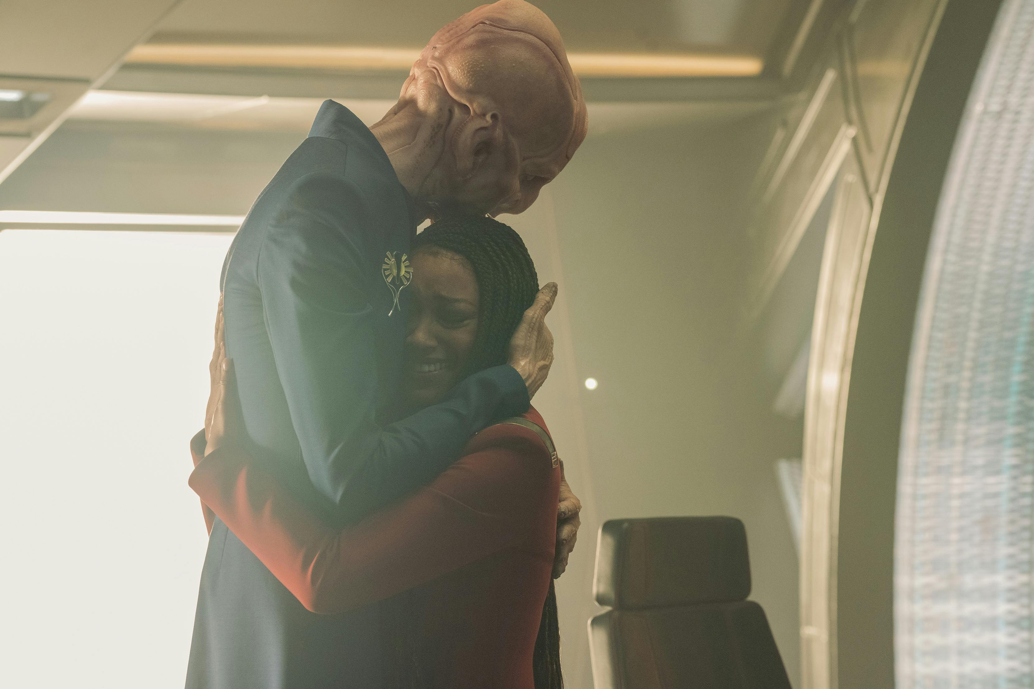 In a flashback, Saru and Michael Burnham embrace each other on the bridge of Discovery in 'Life, Itself'