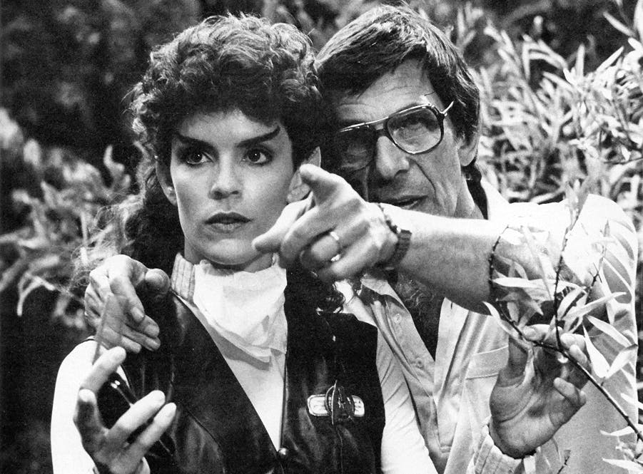 Leonard Nimoy directs Robin Curtis in her role as Saavik pointing in the distance ahead of him while on set of Star Trek III: The Search for Spock