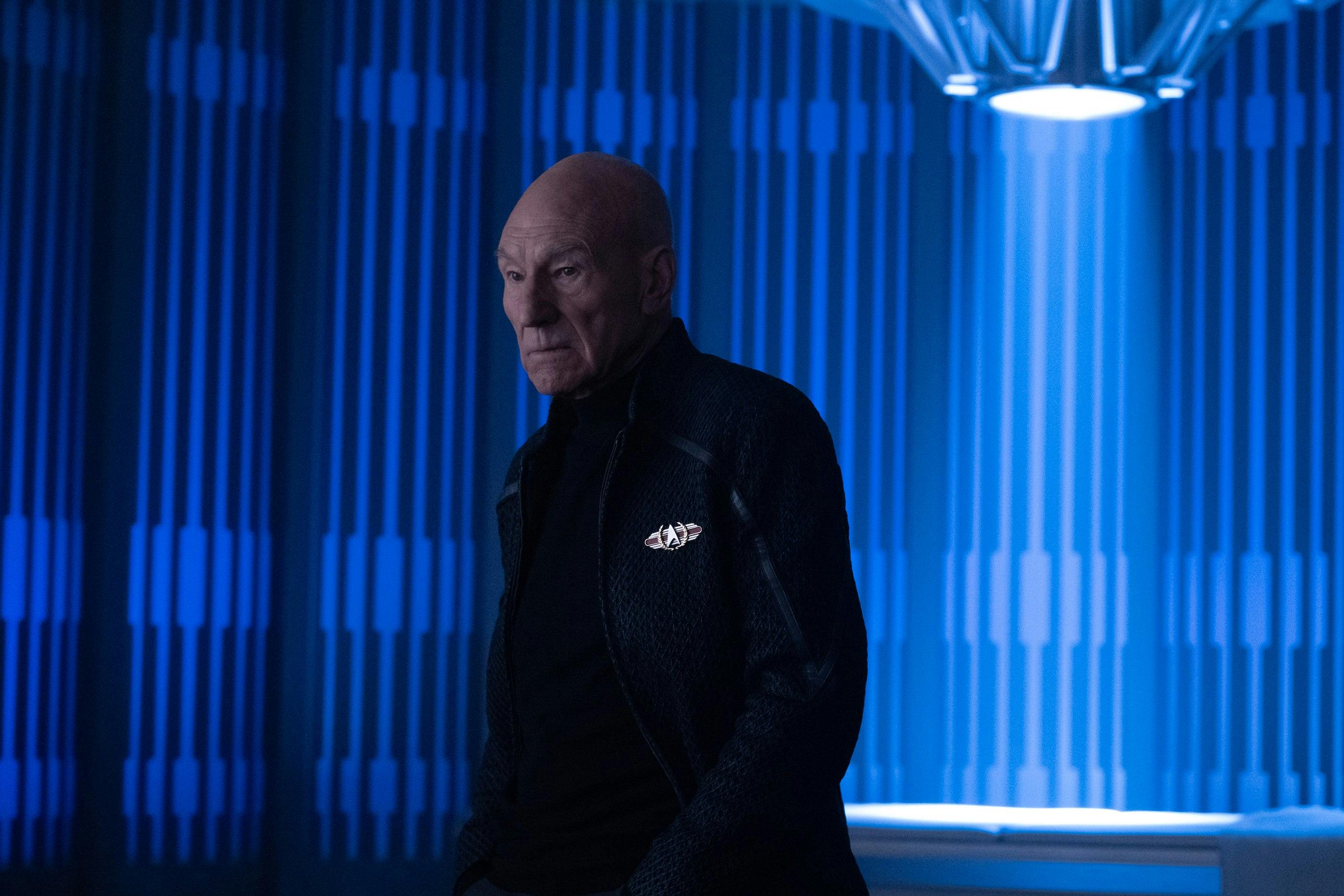 In Sickbay, Picard stands alone with a grim expression with a light over an empty med bed behind him (Star Trek: Picard, "Vox")
