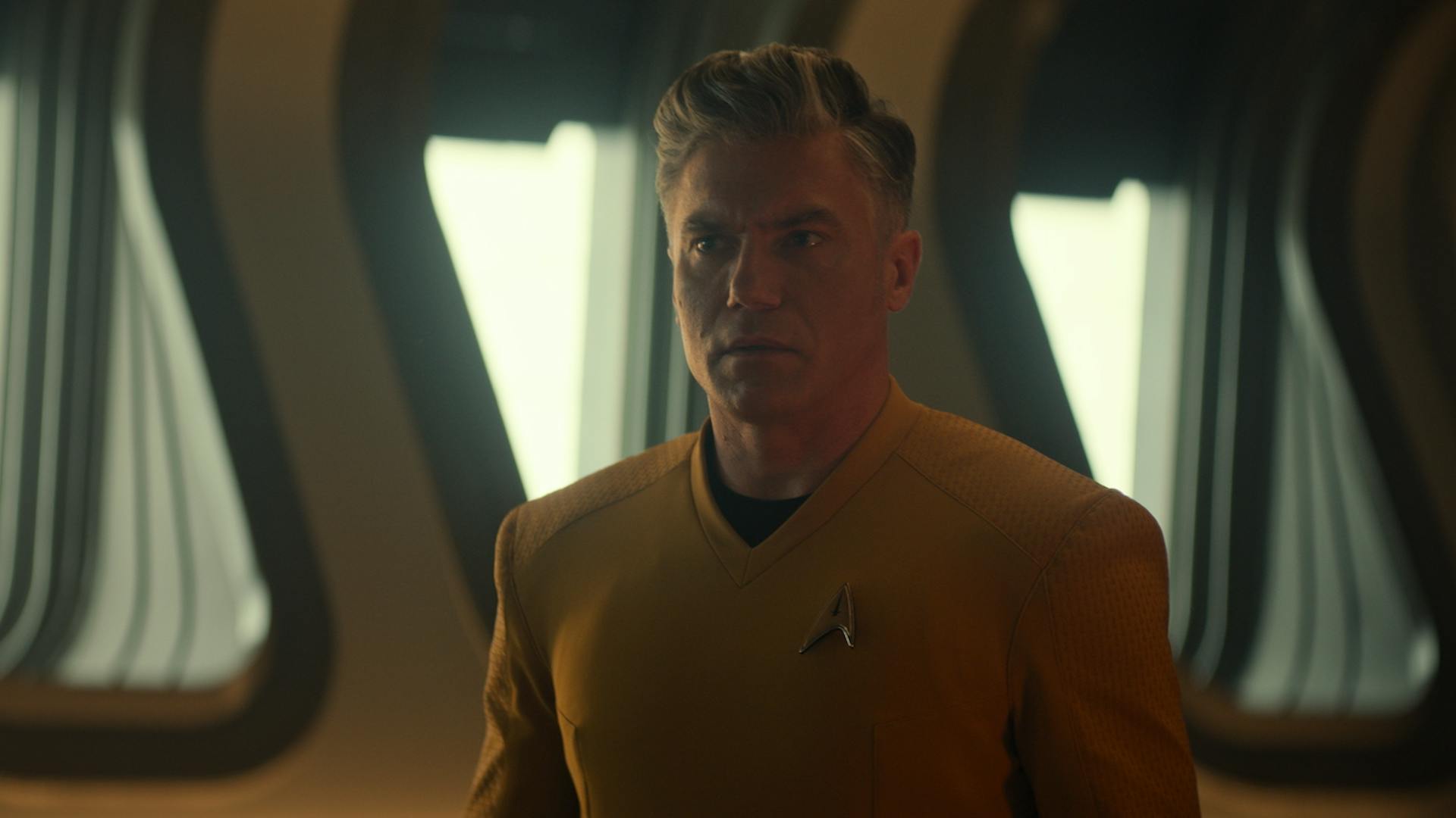 Captain Pike (Anson Mount) stares in confusion at his future self.
