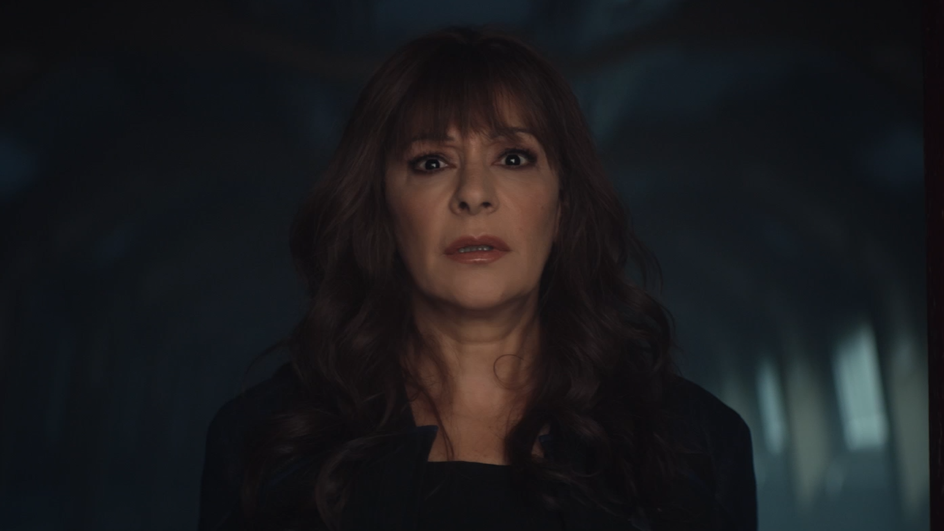 Deanna Troi frozen in shock seeing what's on the other side of the red door in 'Vox'