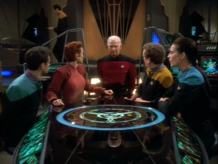 At DS9, Captain Keogh of the U.S.S. Odyssey informs the crew Bashir, Kira, O'Brien, and Dax that traffic through the wormhole is disabled until they can investigate the level threat the Jem'Hadar threat poses in 'The Jem'Hadar'