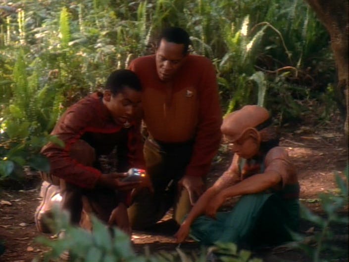 On a M-class planet in the Gamma Quadrant, Sisko kneels between Jake and Nog as they analyze soil samples in 'The Jem'Hadar'