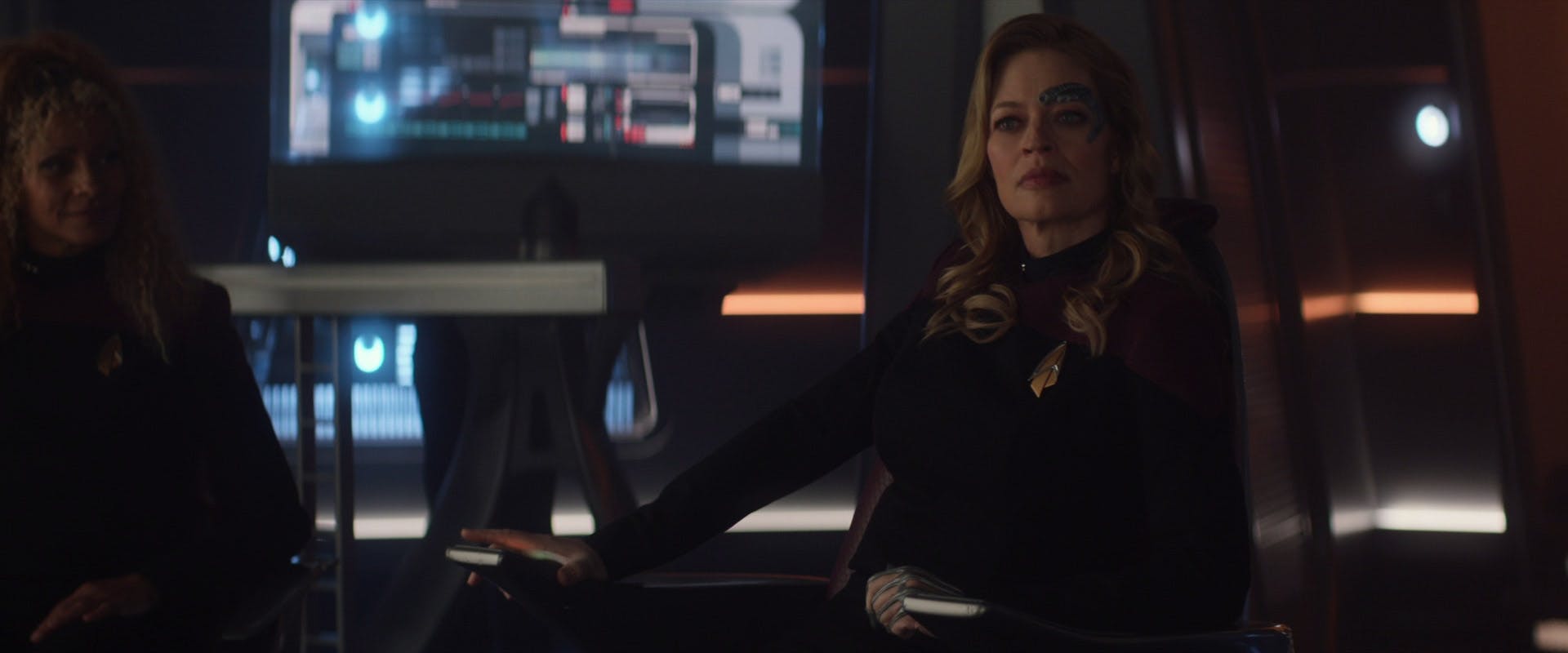 Seven of Nine sits in the captain's chair of the Titan-A, renamed Enterprise-G, in 'The Last Generation'