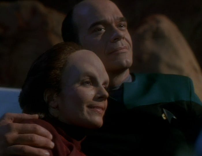 In a tender moment, Dr. Danara Pel cozies up as The Doctor wraps his arm over her shoulder in 'Lifesigns'