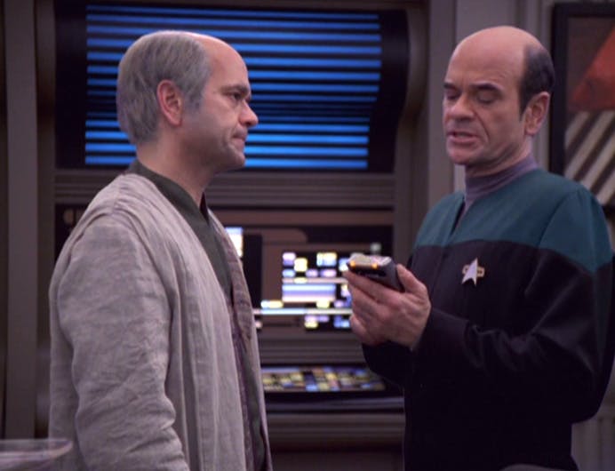 The Doctor consults his tricorder as his 'father' Dr. Lewis Zimmerman looks at him in 'Life Line'